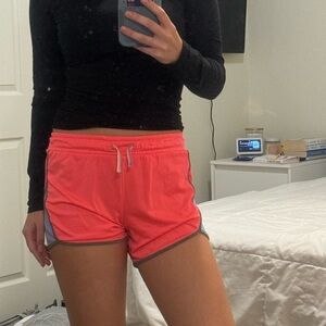 girls pink and purple athletic running shorts